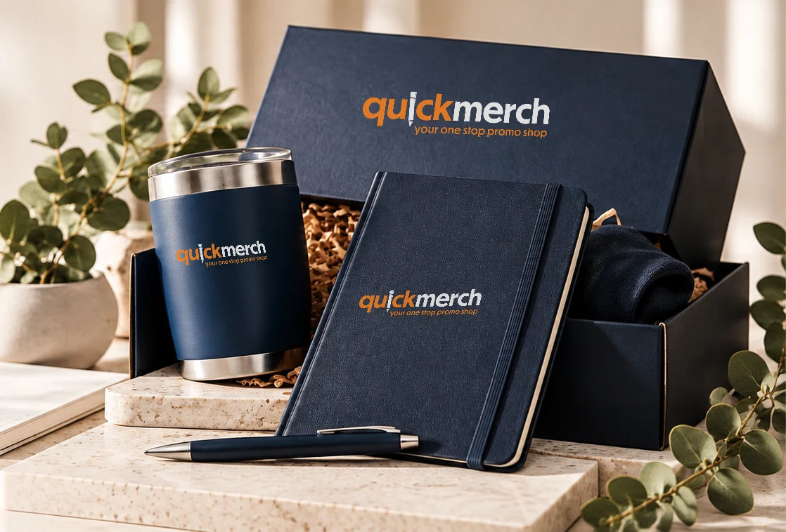 QuickMerch corporate gift box, insulated tumbler, notebook and pen featuring official QuickMerch logo artwork